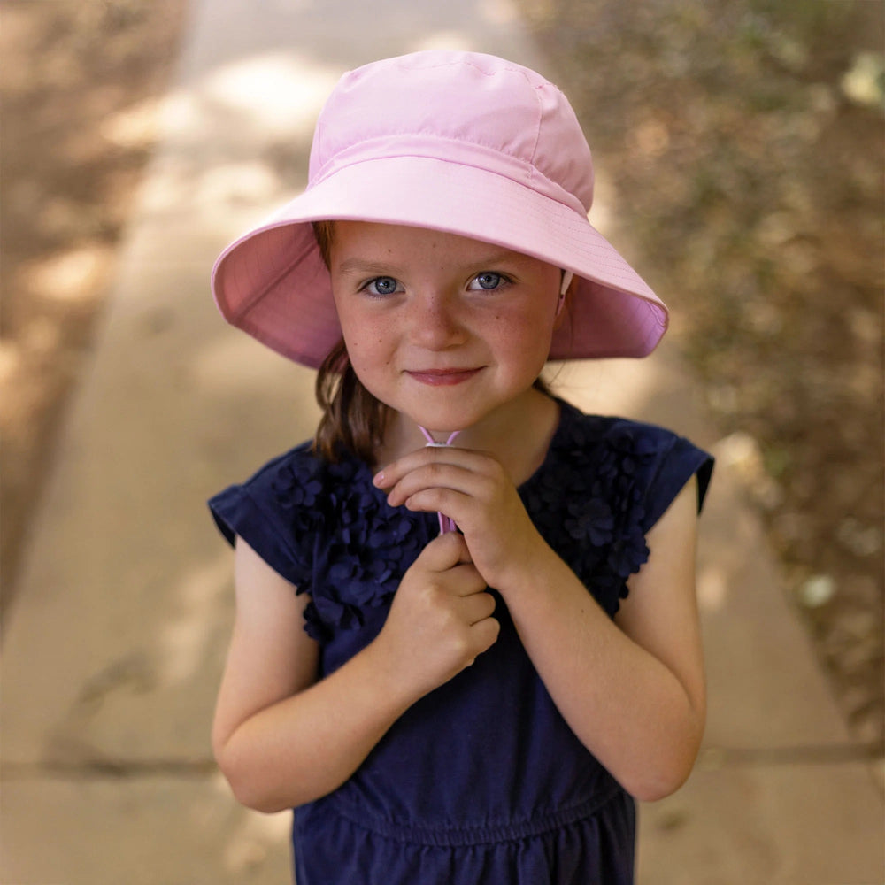 Chapeau évolutif de Jan & Jul rose sorbet vendu par Mlle & Coco