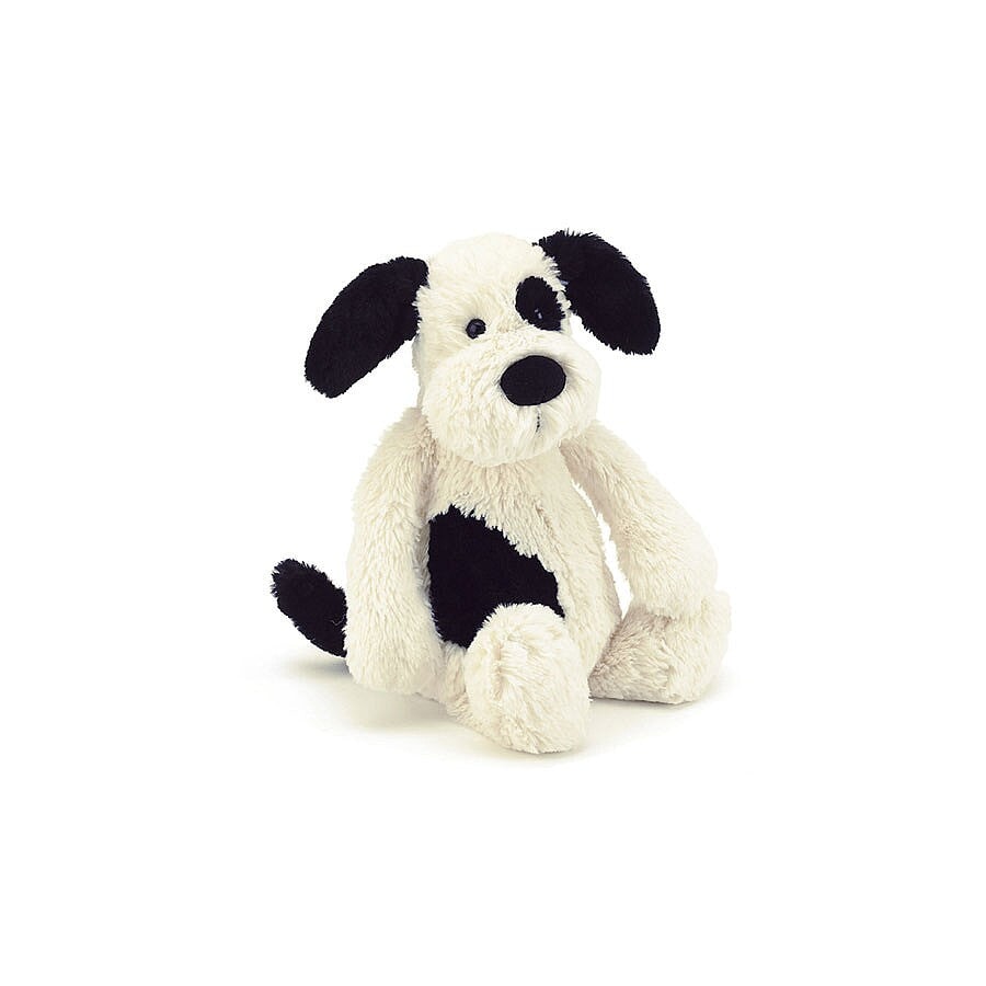 Chiot Jellycat de couleur crème et noire. Parfait pour partir à l'aventure. Mlle & Coco