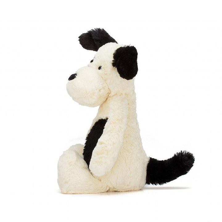 Chiot Jellycat de couleur crème et noire. Parfait pour partir à l&