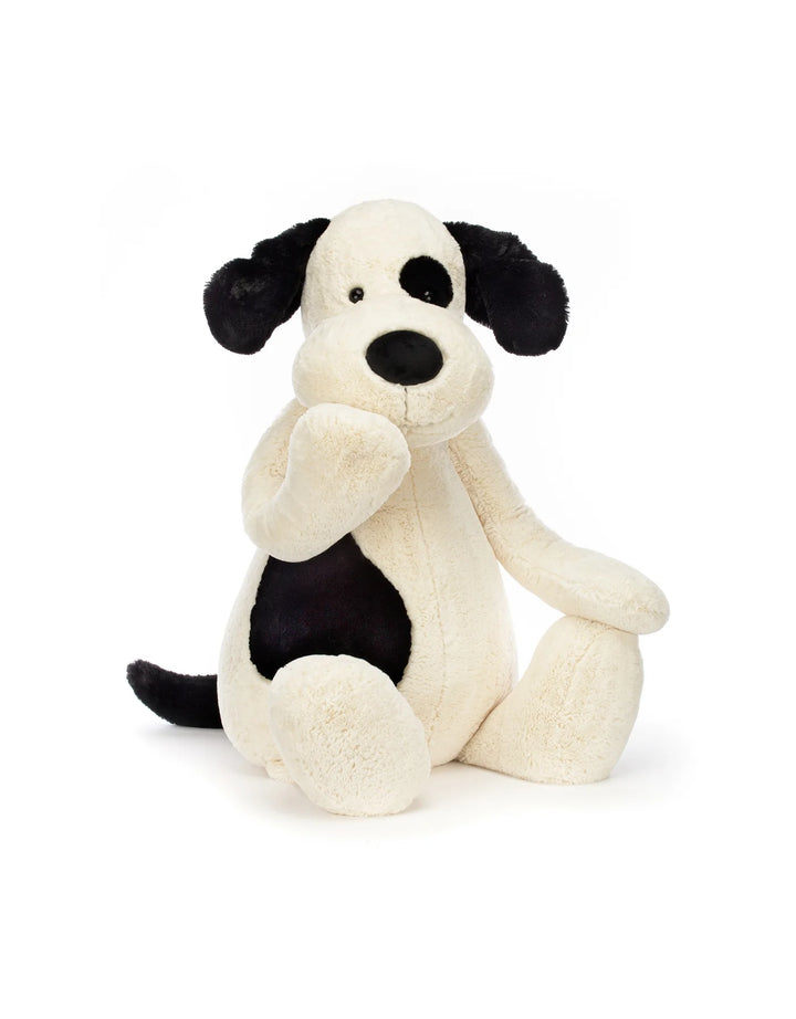 Chiot Jellycat de couleur crème et noire. Parfait pour partir à l&